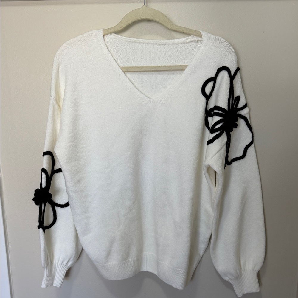 White V-Neck Sweater with Black Floral Appliqué